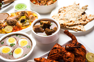 Assorted Indian Non Vegetarian food recipe served in a group. Includes Chicken Curry, Mutton Masala, Anda/egg curry, Butter chicken, biryani, tandoori murg, chicken-tikka and naan/roti