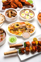 Assorted Indian Non Vegetarian food recipe served in a group. Includes Chicken Curry, Mutton Masala, Anda/egg curry, Butter chicken, biryani, tandoori murg, chicken-tikka and naan/roti