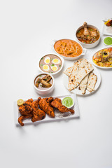 Assorted Indian Non Vegetarian food recipe served in a group. Includes Chicken Curry, Mutton Masala, Anda/egg curry, Butter chicken, biryani, tandoori murg, chicken-tikka and naan/roti