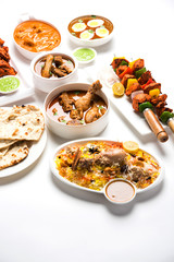 Assorted Indian Non Vegetarian food recipe served in a group. Includes Chicken Curry, Mutton Masala, Anda/egg curry, Butter chicken, biryani, tandoori murg, chicken-tikka and naan/roti