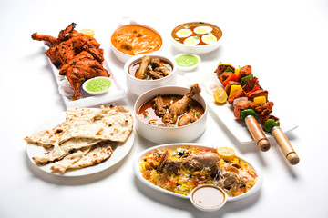 Assorted Indian Non Vegetarian food recipe served in a group. Includes Chicken Curry, Mutton Masala, Anda/egg curry, Butter chicken, biryani, tandoori murg, chicken-tikka and naan/roti