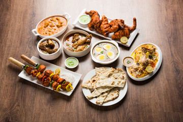 Assorted Indian Non Vegetarian food recipe served in a group. Includes Chicken Curry, Mutton Masala, Anda/egg curry, Butter chicken, biryani, tandoori murg, chicken-tikka and naan/roti