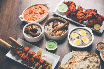 Assorted Indian Non Vegetarian food recipe served in a group. Includes Chicken Curry, Mutton Masala, Anda/egg curry, Butter chicken, biryani, tandoori murg, chicken-tikka and naan/roti