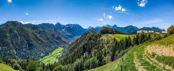 Farm above Logar valley, Alps in Slovenia with farm and meadows © asafaric