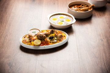 Assorted Indian Non Vegetarian food recipe served in a group. Includes Chicken Curry, Mutton Masala, Anda/egg curry, Butter chicken, biryani, tandoori murg, chicken-tikka and naan/roti