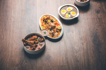 Assorted Indian Non Vegetarian food recipe served in a group. Includes Chicken Curry, Mutton Masala, Anda/egg curry, Butter chicken, biryani, tandoori murg, chicken-tikka and naan/roti