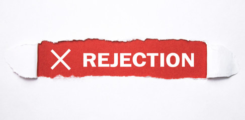 Rejection word on torn paper. - obrazy, fototapety, plakaty