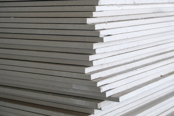 photo of a stack of drywall from close range