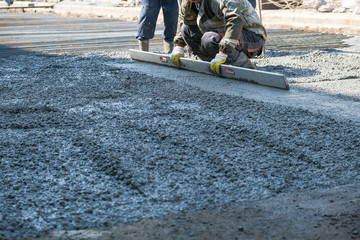 builders poured concrete at the construction site