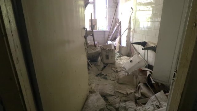 Abandoned room full of random medical items in Pripyat Hospital, Chernobyl Exclusion zone. Consequences of nuclear disaster.