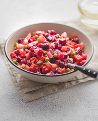 Beet salad Vinaigrette. Russian salad with oil and vinegar. Cold dish of finely chopped vegetables, meat or fish, eggs with spicy sauce