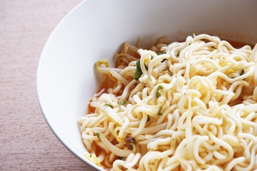 dry tomyum noodle on wooden table