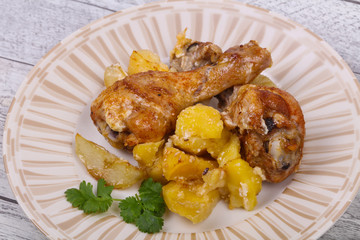 Roasted chicken legs with potato