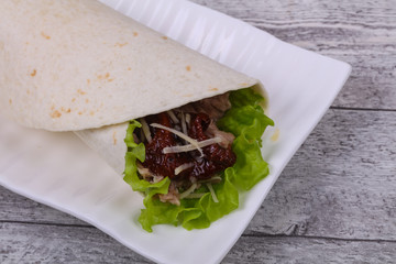 Tortilla with tuna, salad and dried tomato