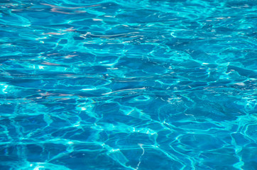 water in swimming pool rippled water detail background