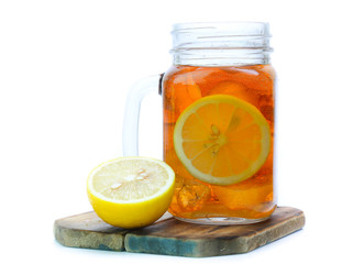 iced tea with lemon slices and mint on white background