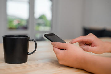 woman using smartphone office supplies technological devices inside home