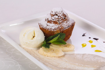 Tasty hot muffin with ice cream