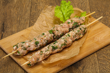 Raw minced pork skewer kebab for grill