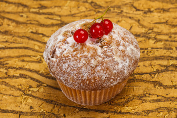 Sweet tasty muffin with red currants