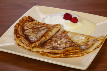 Pancakes with sour cream and condenced milk
