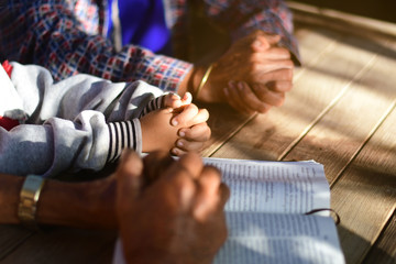 The boy prayed on the table. The family prayed together.