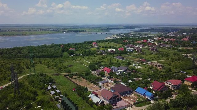 Aerial view of Slatina city and river Olt, Romania. Drone flight over the european city in summer day.
