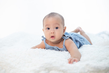 A little boy lying in the bed