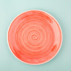 Salmon color plate on the light blue background