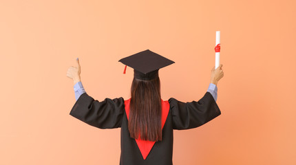 Female graduate with diploma on color background