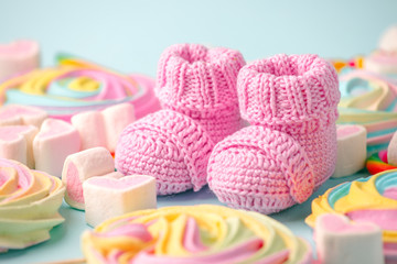 close-up of baby shoes, baby shower decoration - sweetness and baby booties on blue background, first newborn party background