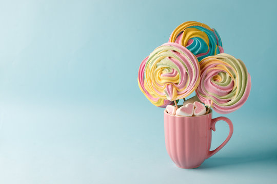 Hinamatsuri (Girls' Day) concept, rainbow sweetness on blue background, concept of holiday and childhood, copy space. Saint Valentine, birthday, mother day card - Powered by Adobe