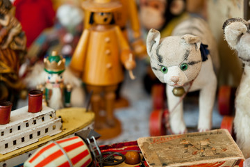 group of vintage dolls and ancient plush animals