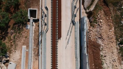 Underpass and tunnel for the construction of a new railway line. Detail of sewage and metal lattice ducts for the electrification of the railway line.