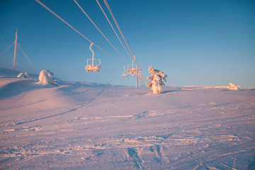 Winter mountains panorama with ski slopes and ski lifts near Vogel ski center, Slovenia