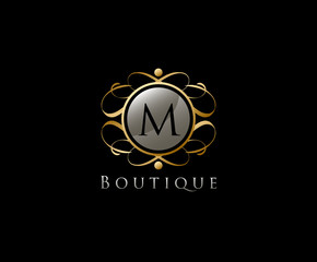 Royal Boutique Letter M Logo Icon in Gold Color.