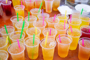 Colorful soft drink in plastic cup