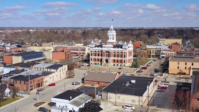 Aerial over Franklin, Indiana, a quaint all American Midwest town with pretty central courthouse.