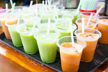 Colorful soft drink in plastic cup