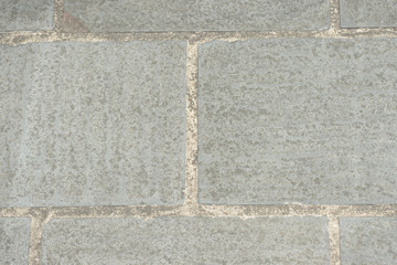 Gray paving slabs closeup, top view. Abstract background
