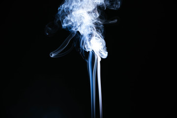 White wavy smoke on black background