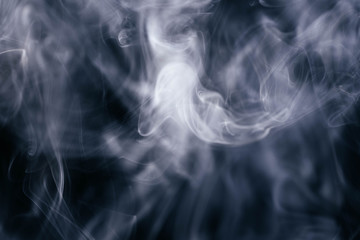 White wavy smoke on black background