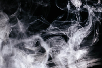 White wavy smoke on black background