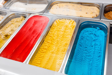 Colorful ice-cream on display in candy shop