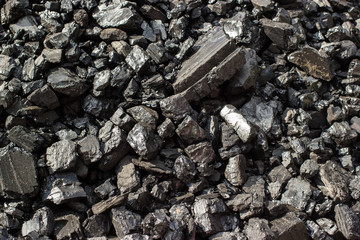 Pile of natural black hard coal for texture background. Grade anthracite coals often referred to as stone coal and black diamond coal.