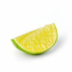 Juicy slice of lime isolated on white