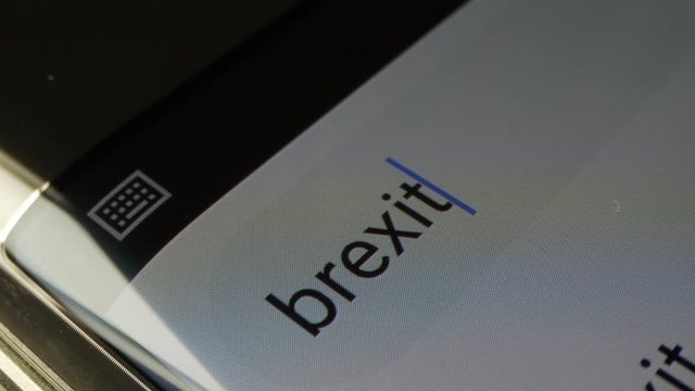 Searching Brexit News On The Phone. Close Up