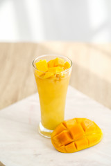 Mango Boba Bubble Milk Tea with bubble topping for tea or other beverage on the wood table with copy-space for textures and wall Natural light background