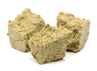 Obraz premium sliced halva on a white background