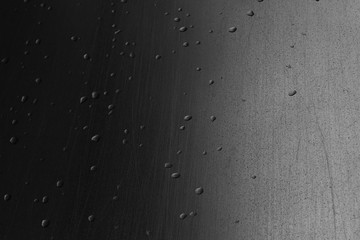 water drops on black and white grey metal industrial surface background
